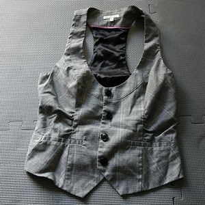 Black and white patterned vest with buttons